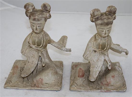 Two Chinese pottery seated figures of ladies, probably Tang dynasty, height 18cm, repairs